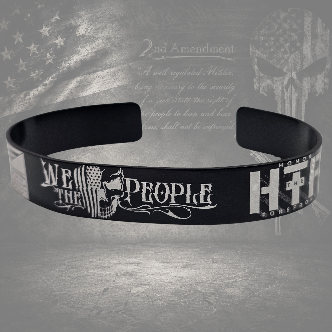Close-up of We the People 2A bracelet with detailed American flag and constitutional engraving