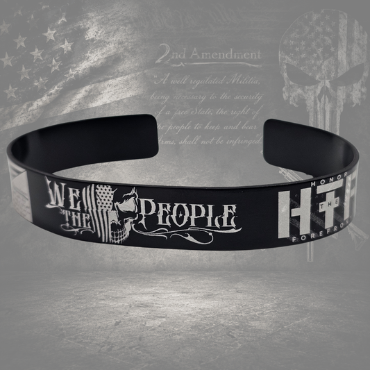Close-up of We the People 2A bracelet with detailed American flag and constitutional engraving